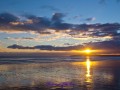 Sonnenuntergang am Camber Sands Beach bei Ebbe
