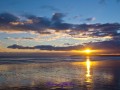 Sonnenuntergang am Camber Sands Beach bei Ebbe